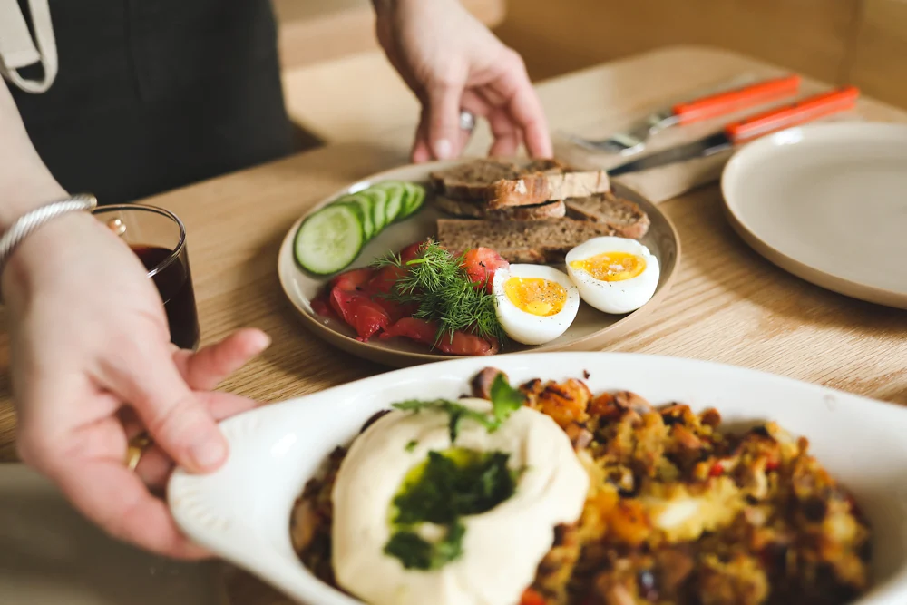 Two plates of delicious food being placed on a table